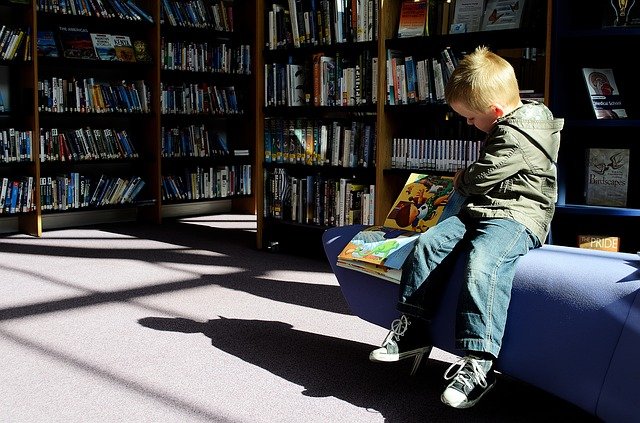 child reading in a library