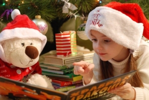girl reading a Christamas book 