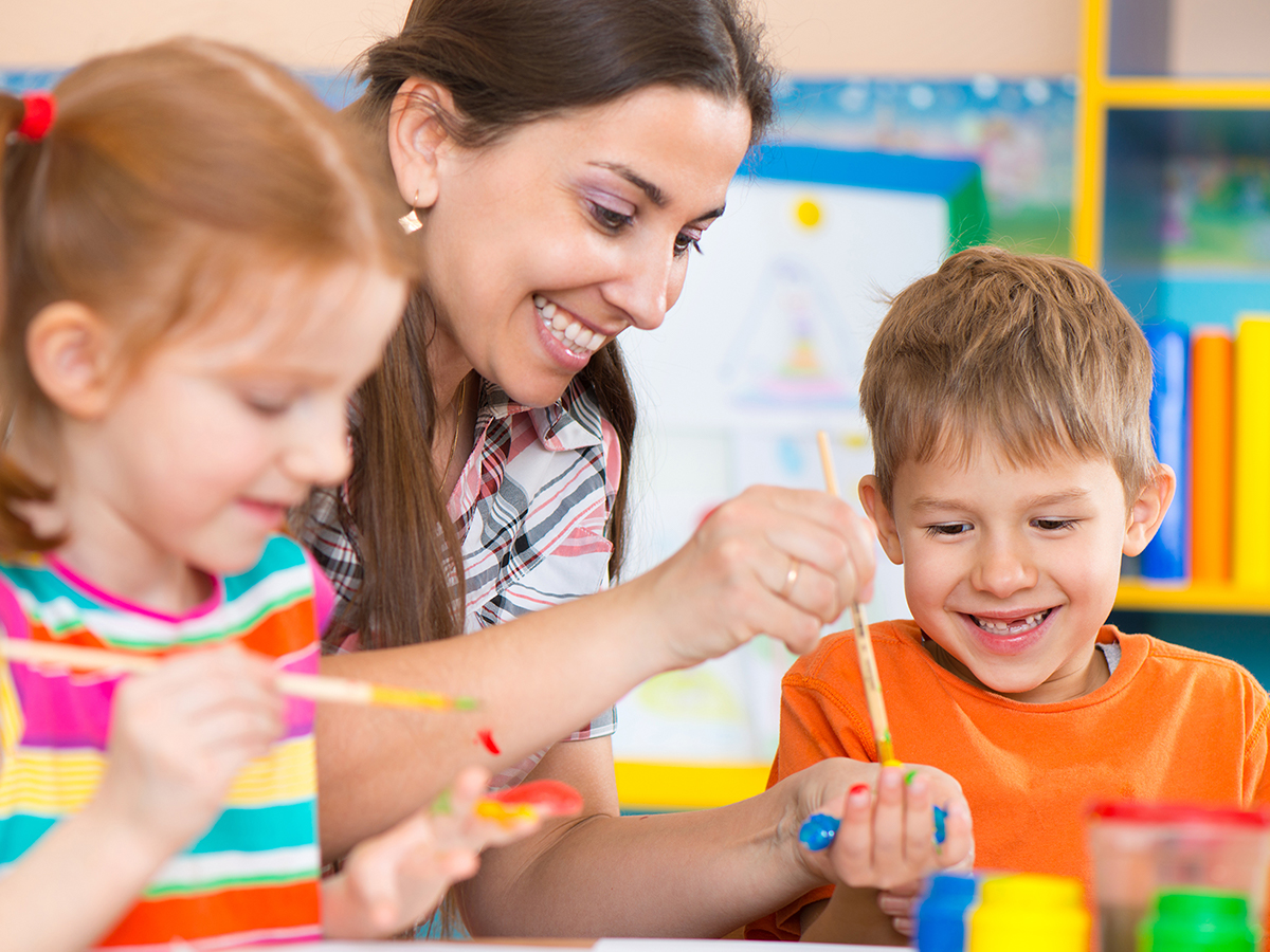 Teacher facilitating art time with children