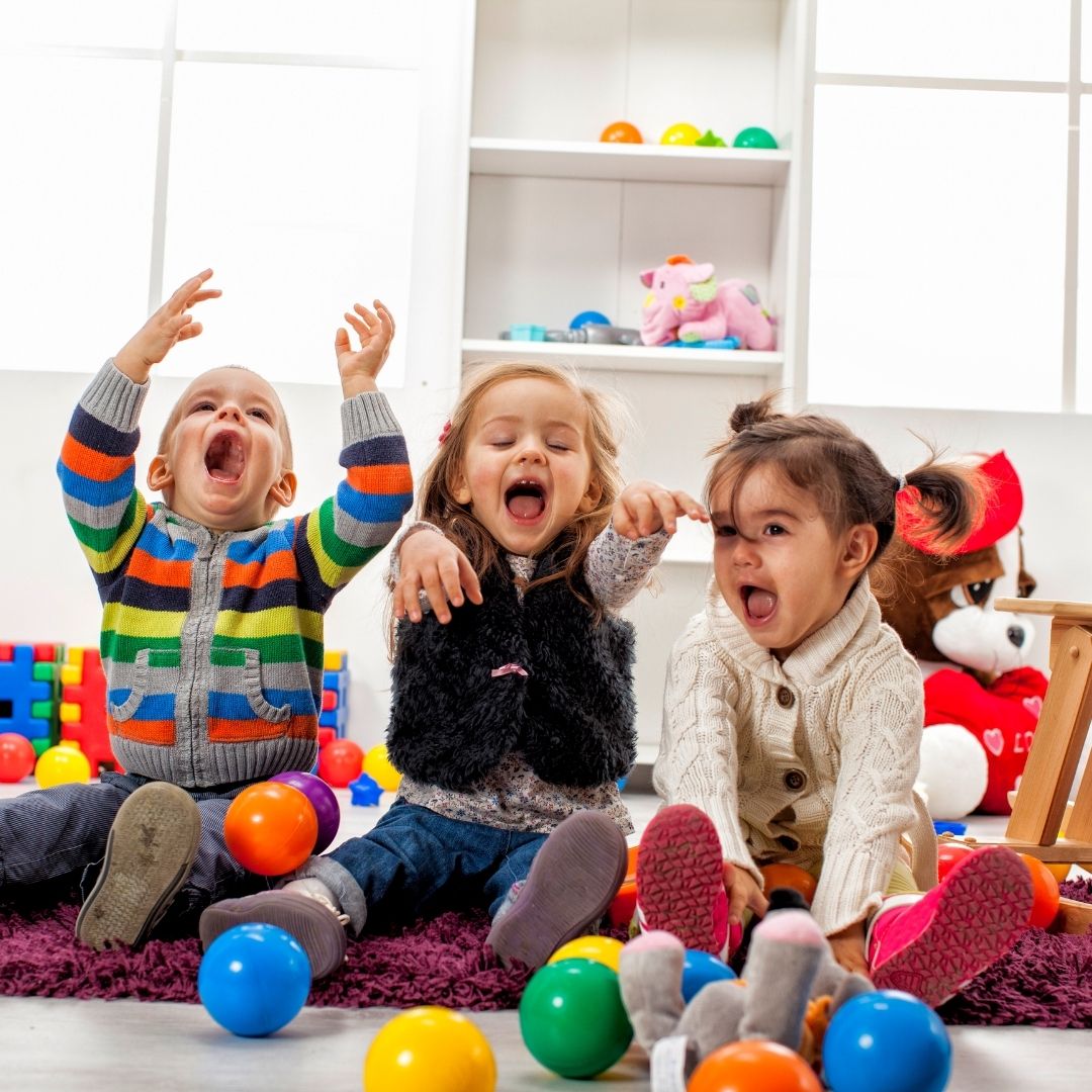 An image of three kids playing.