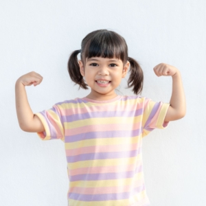 img of a little girl flexing her arms