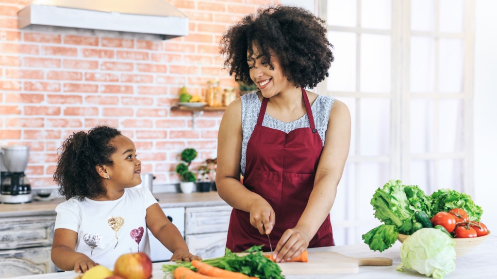 Daughter cooking in the kitchen with mom
