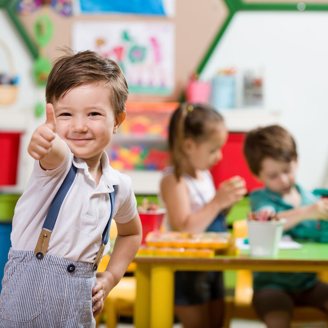 preschooler giving a thumbs up
