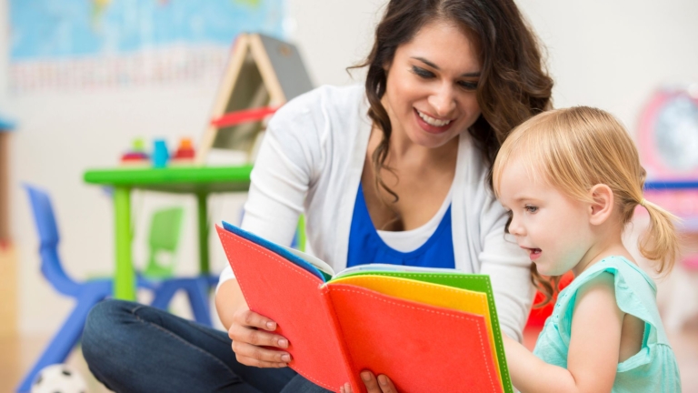 A mother helping her child learn to read.