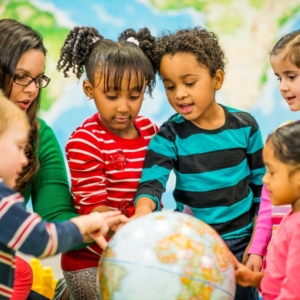 preschoolers with globe