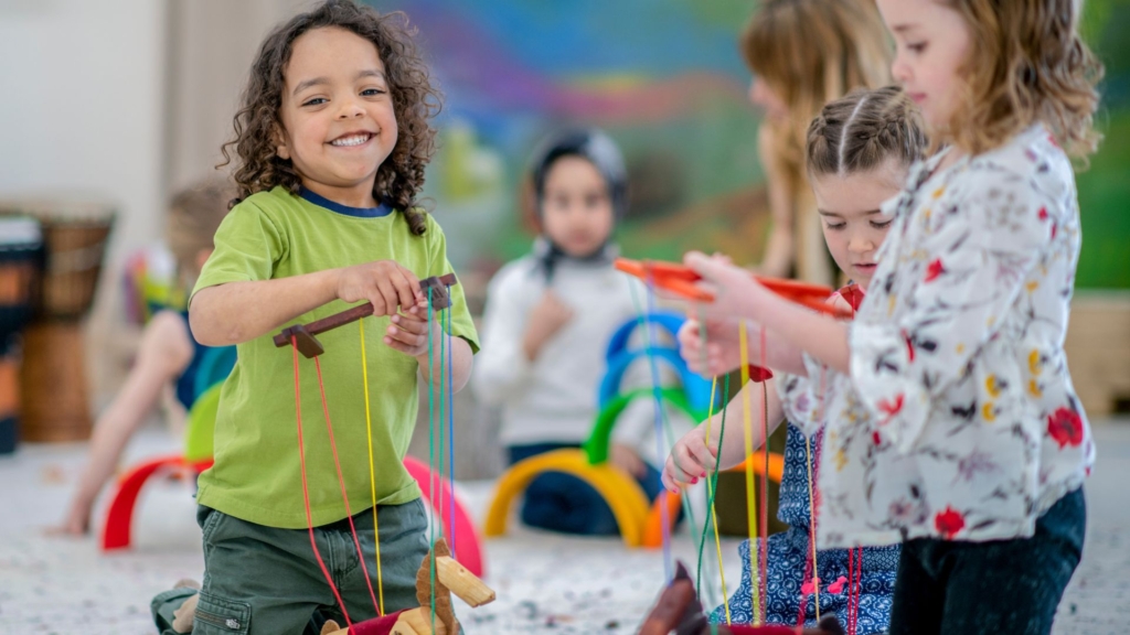 preschoolers playing with puppets