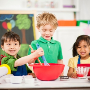 kids playing in play kitchen