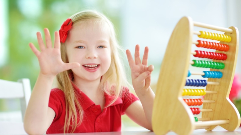 a little girl with an abacus counting to eight