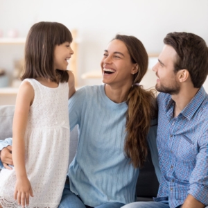 little girl talking to parents