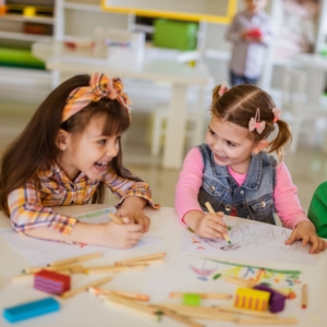 Preschooler sitting together and laughing