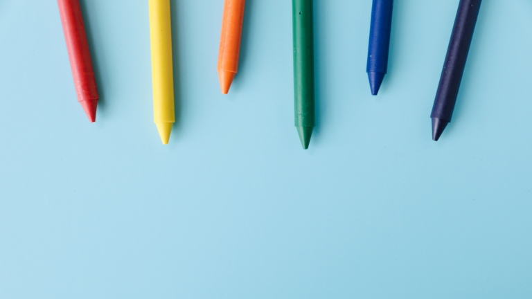 Colored pencils on a blue background