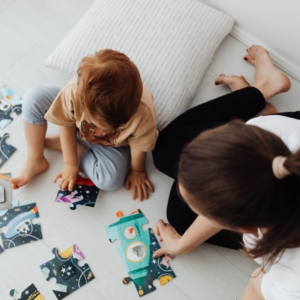 toddler solving puzzle