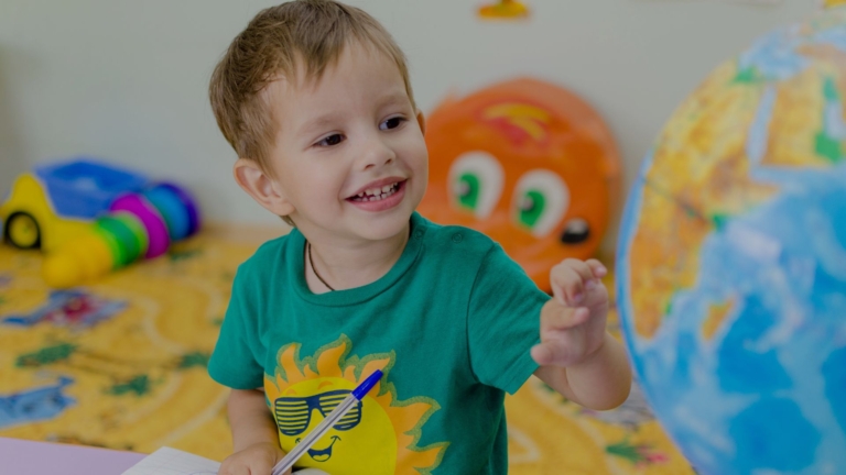 kid smiling in classroom