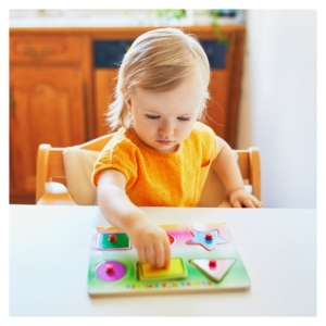 preschooler completing a puzzle