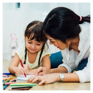 teacher helping girl